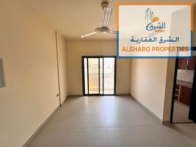 Two bedrooms and a living room, balcony, 2 bathrooms, spacious layout, central air conditioning, easy access to Dubai and Sharjah, prime location.