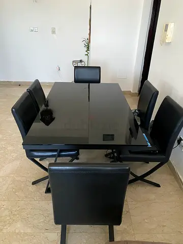 Black glass dining table with 6 matching chairs