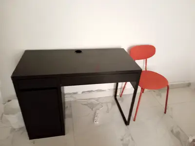 IKEA black computer desk with small storage cabinet — good condition