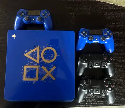 Sony PlayStation 4 with 4 Controllers - Good Working Condition