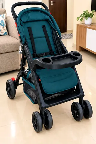 Well-kept teal baby stroller with snack tray and storage basket