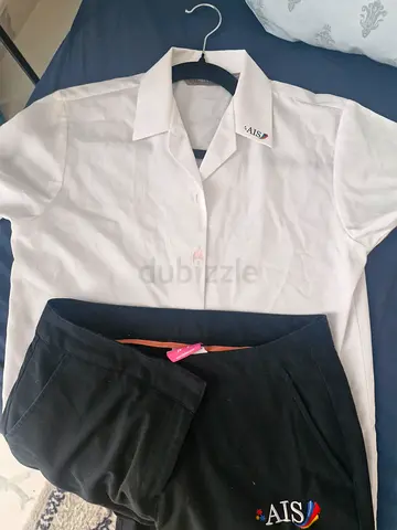 White collared shirt and blue AIS branded pants - excellent condition. UNIFORM for Australian Intern