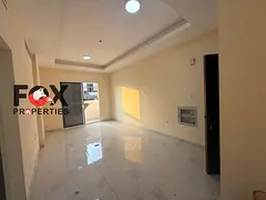One-bedroom apartment with a living room for annual rent in Al Jurf 3, Ajman | Master bedroom and ba