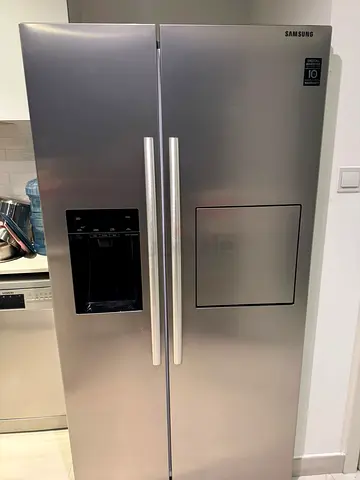 Samsung side by side fridge and freezer new model slightly used with ice maker water dispenser