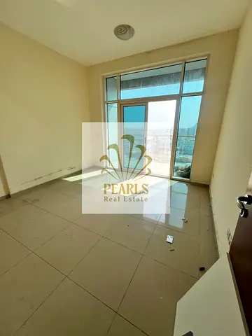 Spacious 3-bedroom apartment with a living room and maid's room in Al Nuaimiya 1, Ajman; located on Al Ittihad Street next to Emirates Markets, featur