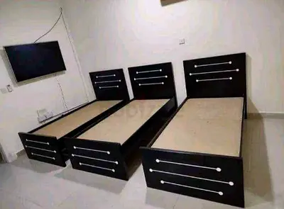 Three single wooden beds - sturdy black frames, good condition