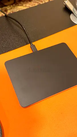 Apple Magic Trackpad with USB-C charging.