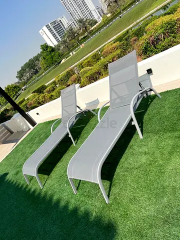 Pair of outdoor sun loungers / poolside chaise lounges - grey mesh