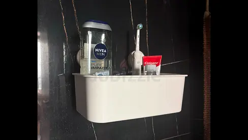 Wall-mounted with succion for bathroom organizer shelf (used) - holds toiletries, toothbrushes