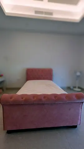 Single Pink bed with tufted headboard