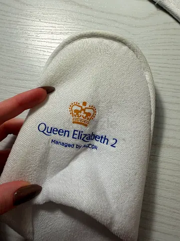 Pair of white Queen Elizabeth 2 hotel slippers