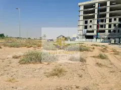 Commercial/residential land in Al-Arqoub, permit for ground floor + 4 floors, freehold ownership for