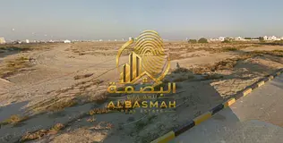 Corner commercial land for sale in Arqub.