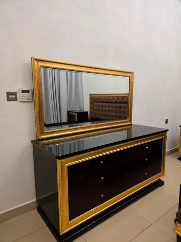 Brown wood Bed and Dresser with gold trim and large matching mirror — good condition