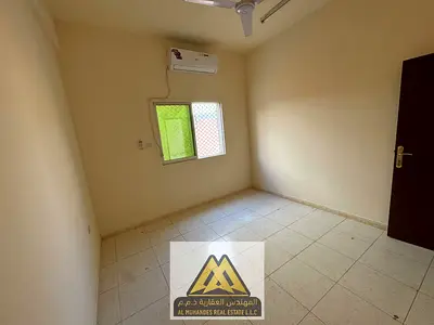 شقة غرفتين وصالة للإيجار السنوي في الروضة 2 عجمان | طابق أرضي | 2 حمام | تكييف سبليت | 24,000 درهم على 4 دفعات