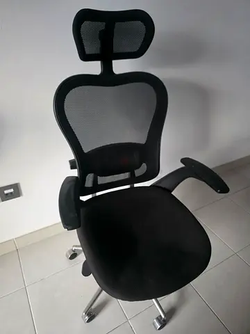 Ergonomic Black Mesh Office Chair with Headrest for urgent sale. Negotiable, Need to go urgently.