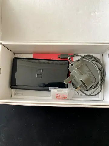 Nintendo DS Lite with charger and original box - good condition