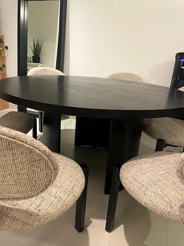 Round black wooden table (chairs not included)