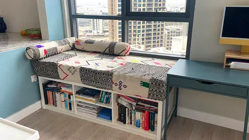 Bench with built-in bookshelf and desk — cozy reading nook