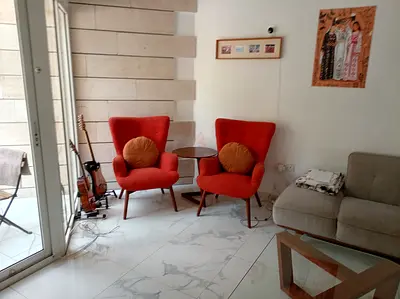 Pair of Mid-century Style Orange Accent Armchairs with Side Table