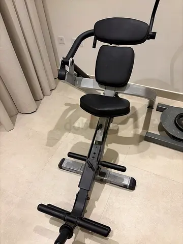 Used adjustable multi-function workout bench with preacher pad and leg curl attachment