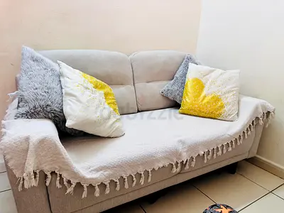2-seater light grey fabric sofa in good condition .Used only 6 months .
