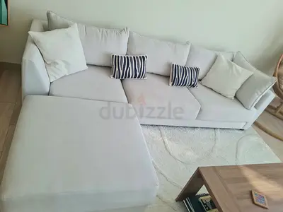 White L-shaped fabric corner sofa with ottoman - good condition