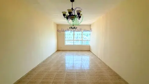 غرفتين وصالة للإيجار السنوي في التعاون على مخرج دبي، تكييف مجاني، غرفة ماستر، مساحات واسعة، باركن وجيم ومسبح مجاني