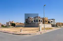 Land for sale in Muhadhab—freehold ownership available to all nationalities. Prime location close 