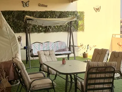 Outdoor patio dining table with 6 cushioned chairs