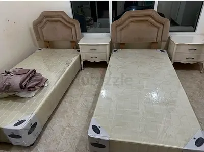 Pair of single beds with headboards and 2 bedside tables