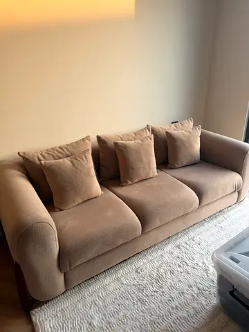 Beige 3-seater fabric sofa with cushions