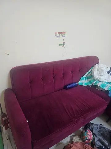 Used plum velvet 3-seater sofa in good condition