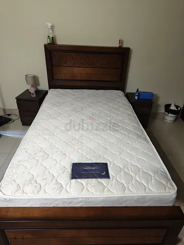 Solid wood single bed frame with mattress and bedside tables