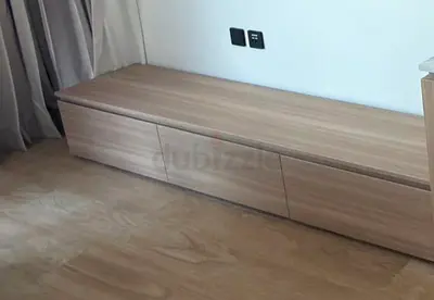 Low wooden TV cabinet with three drawers - light oak finish
