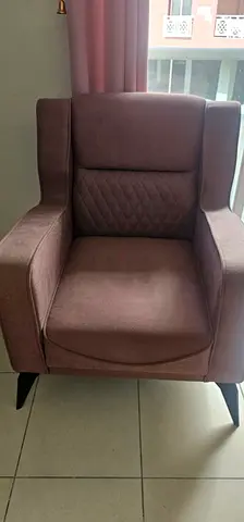 Comfortable single upholstered armchair in mauve - gently used