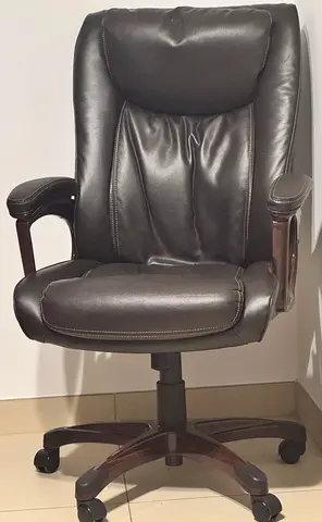 Brown leather executive office chair with wooden accents - good condition