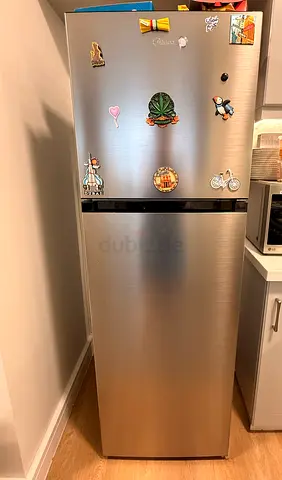 Silver two-door refrigerator - good condition, energy efficient
