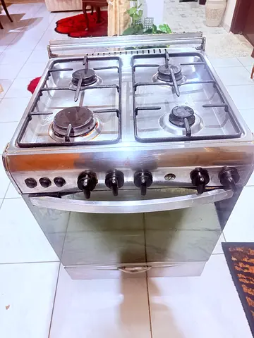 Used stainless steel 4-burner gas cooker with oven - good working condition