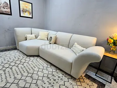 Light beige curved 3-seater sofa in excellent condition