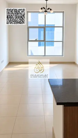 One-bedroom apartment with a living room for annual rent at Al Madina City Tower.