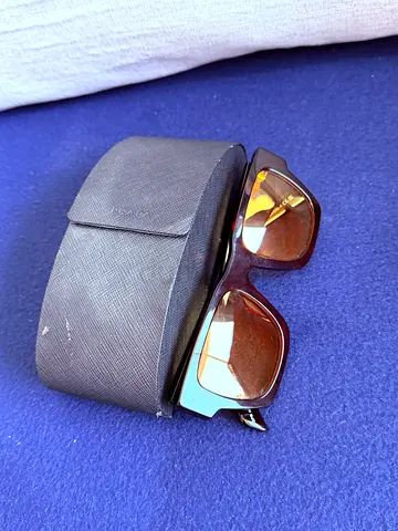 Prada black designer sunglasses with hard case