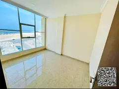 A nice one-bedroom apartment with a living room and a view of the corniche