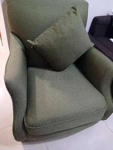 Green upholstered armchair with cushion - good condition