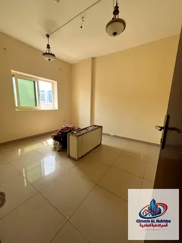 Beautiful 1BR near Corniche Al Majarra, central AC & gas, flexible pay, free owner maintenance, prime location, easy access to Dubai exit.