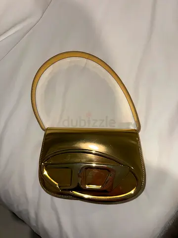 Small metallic gold women's handbag Diesel with top handle