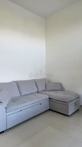 Light grey L-shaped sectional sofa — good condition
