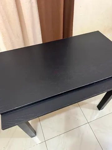 Solid black wooden coffee table, simple modern design