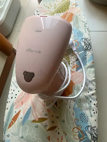 Steaming iron with ironing board