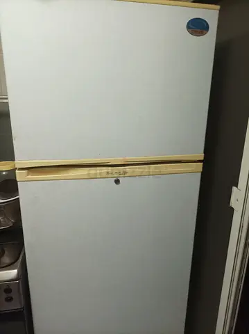 Used top-freezer refrigerator - good working condition